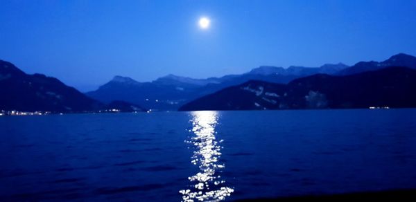 Scenic view of sea against sky at night