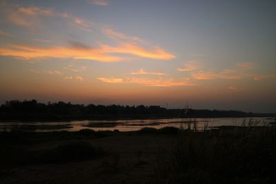 Scenic view of silhouette landscape against sky during sunset