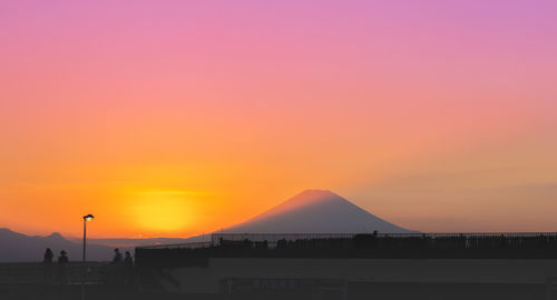 Scenic view of silhouette landscape against romantic sky at sunset