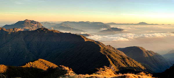 Panoramic view of snowcapped mountains against sky during sunset