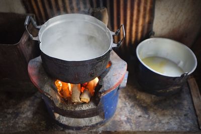 Food preparing in utensil on wood burning stove