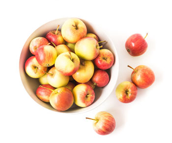 High angle view of apples and fruits over white background