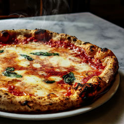 Close-up of pizza served on table