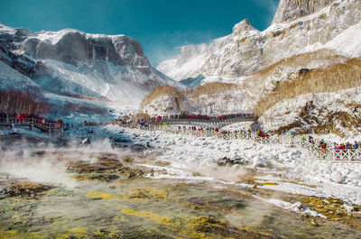 Scenic view of mountains against sky during winter