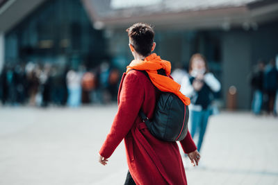 Rear view of couple standing in city