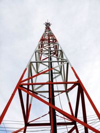 Low angle view of communications tower against sky