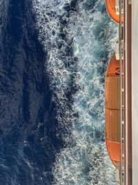 High angle view of ship sailing in sea