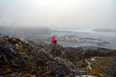 The hiker with his own thoughts on the top of the mountain