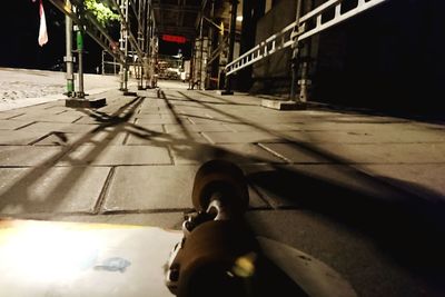 Woman sitting on street in city