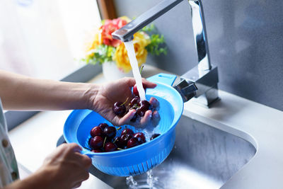 Cropped hand of person preparing food