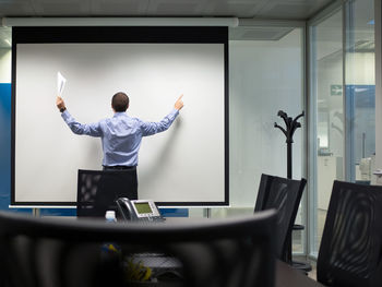 Full length of man working in office