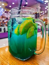 Close-up of drink in glass jar on table