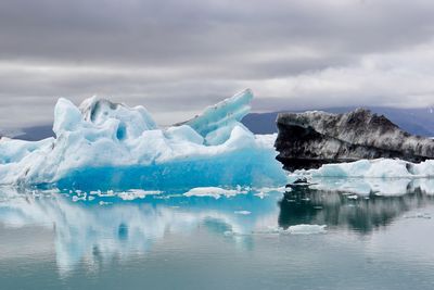 Scenic view of frozen sea against sky