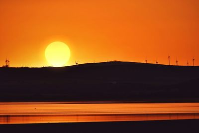 Scenic view of silhouette landscape against romantic sky at sunset