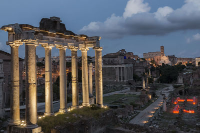 Panoramic view of illuminated temple against sky in city