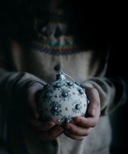 Close-up of hand holding ice cream