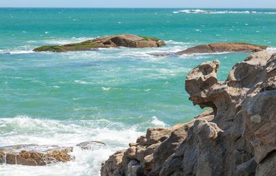 Scenic view of rocks in sea