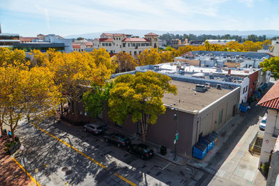 High angle view of houses in town against sky