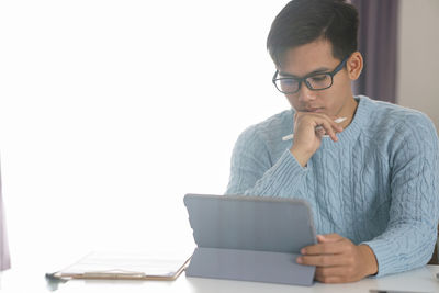 Young man using mobile phone