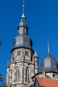 Low angle view of building against blue sky