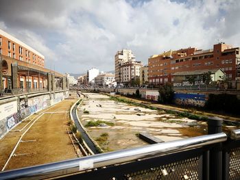Panoramic view of city street and buildings against sky