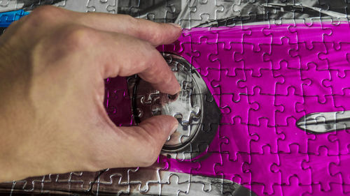 High angle view of man working on metal