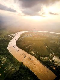 Aerial view of landscape against sky during sunset