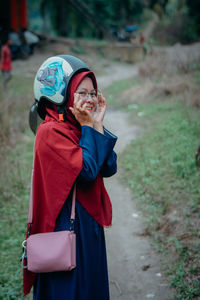 Full length of woman standing on field