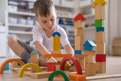 Boy playing with toy blocks