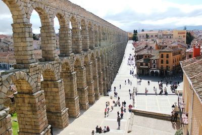 Tourists at entrance of historic building