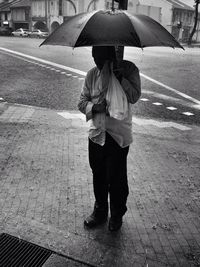 Man standing on road