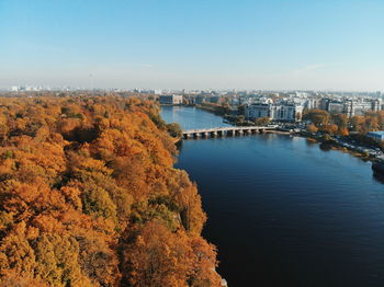 High angle view of river amidst buildings against sky