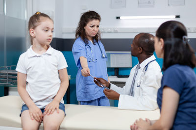 Doctors with patient at hospital