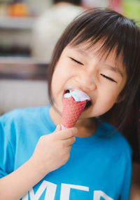 Close-up of woman holding ice cream