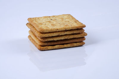 Stack of bread against white background