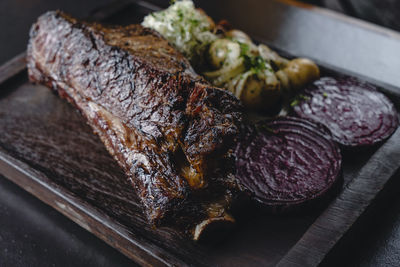 High angle view of meat on cutting board
