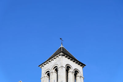 Low angle view of a building against clear blue sky