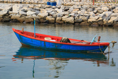 Boats moored at lake