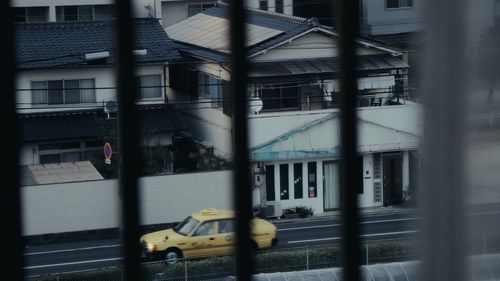 Blurred motion of train against buildings in city