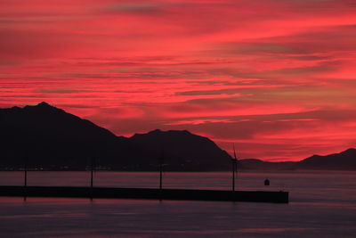 Scenic view of sea against orange sky