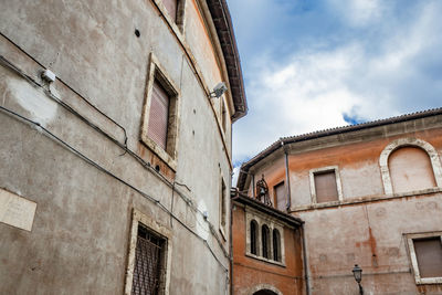 Low angle view of old building against sky