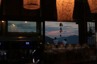 Reflection of silhouette man on glass window