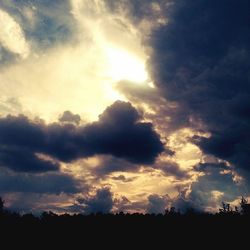 Scenic view of landscape against cloudy sky