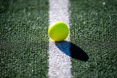 Close-up of yellow ball on grass