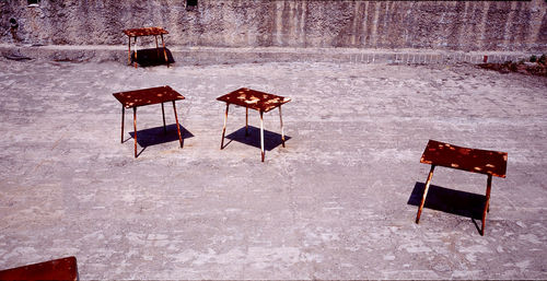 High angle view of empty chairs and table