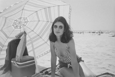 Portrait of woman sitting on beach