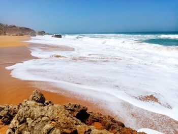 Scenic view of beach against sky