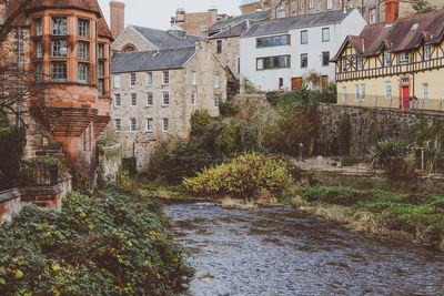 Scenic view of river in city