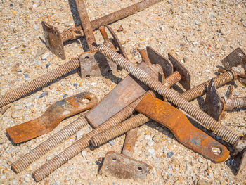 High angle view of rusty chain on metal