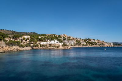 Scenic view of sea against clear blue sky